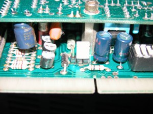 A recapped example of an audio card -- the dark blue cylinders are replacements.