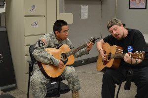 A wounded soldier participates in music therapy (Photo by flickr user Lori Newman)