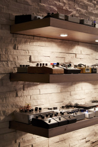 A stone wall adds diffusion and supports custom shelves for a pedal-based effects.