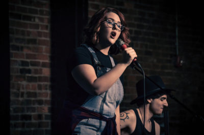 Juliana Wilson, seen here backed up by Matty Amendola onstage -- the two are also top teammates in the studio.